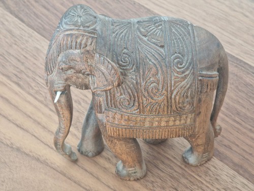 Intricately carved wooden - intricately,