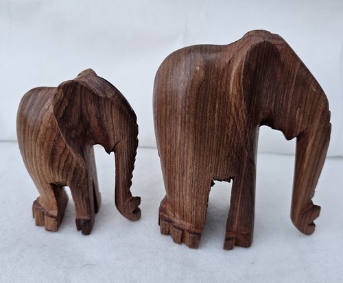 Pair hand carved wooden - of,